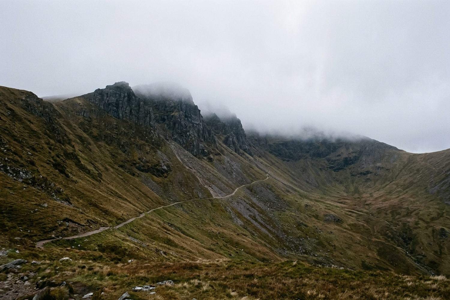 A rock walled hollow high in bare mountain ground.