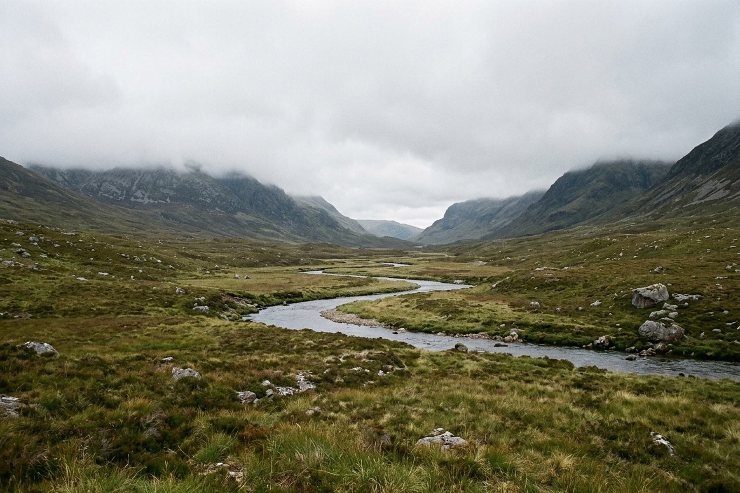 A long empty glen running inland between steep sides.